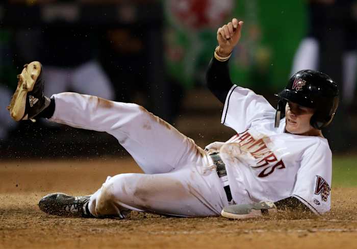 SF Giants prospect Hayden Cantrelle slides into home plate during his time with the Wisconsin Timber Rattlers.
